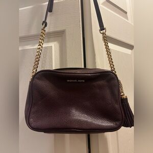 Deep purple Michael kors crossbody purse.